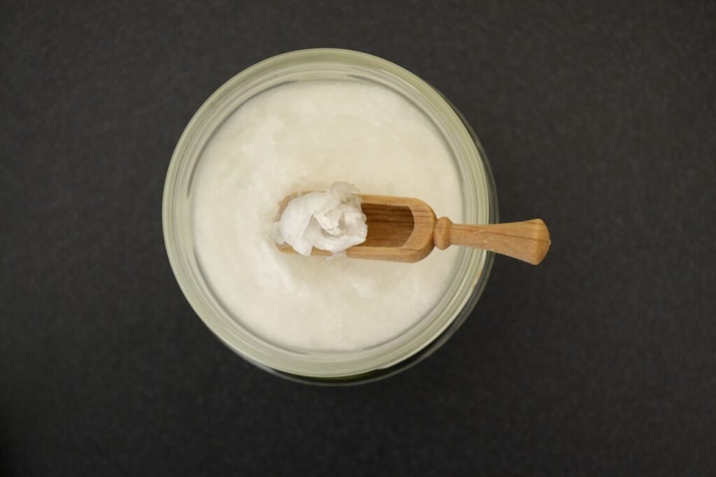 coconut oil in jar, wooden spoon, healthy-2090043.jpg